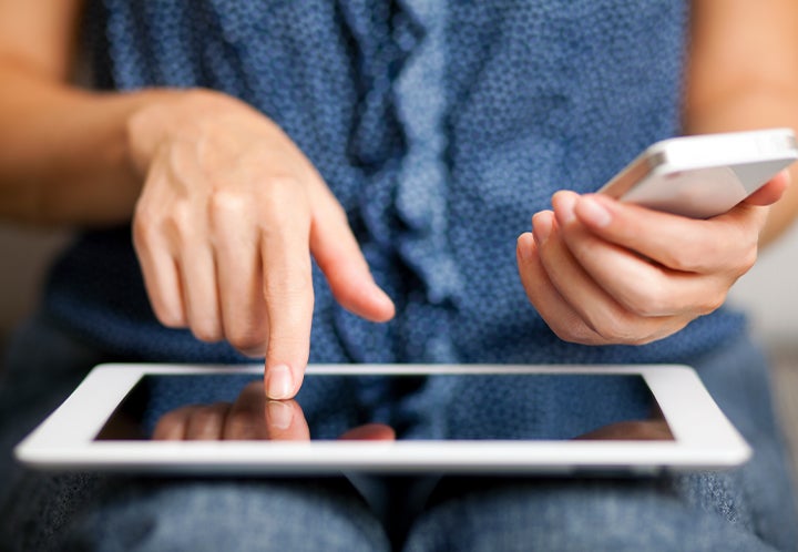 Woman on iPad and Phone
