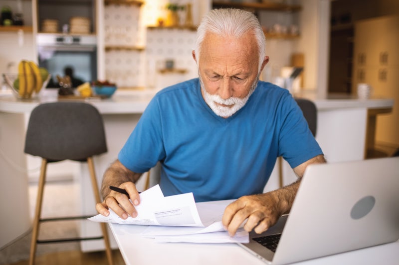 Man reviewing medical bills